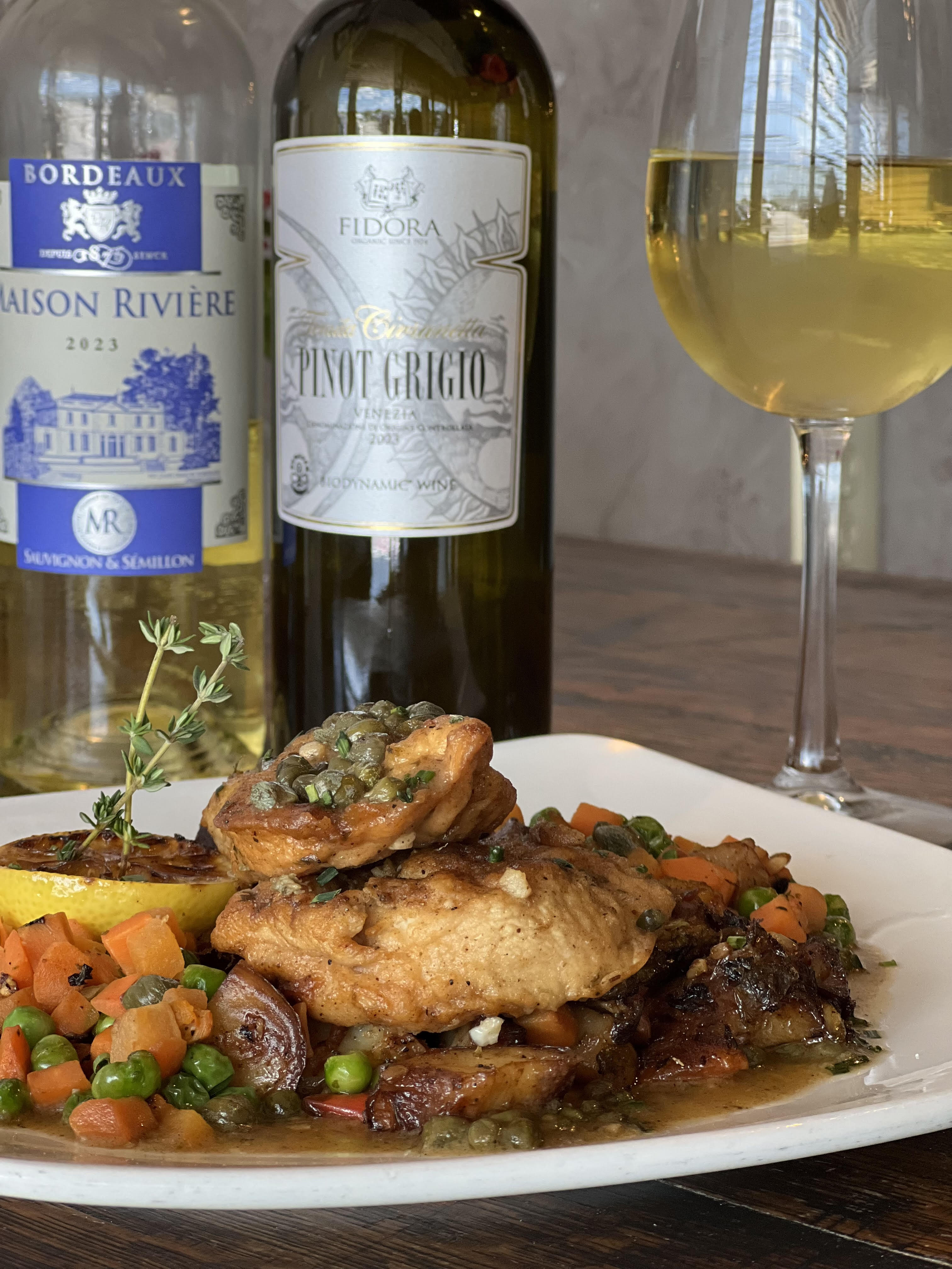 Pan-seared chicken with root vegetables and wine selection